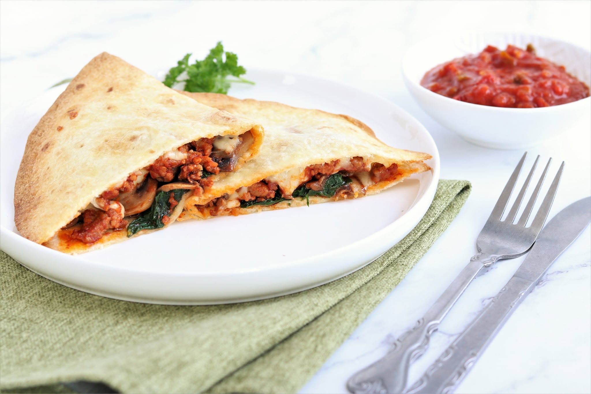 Folded savoury flatbread on a plate